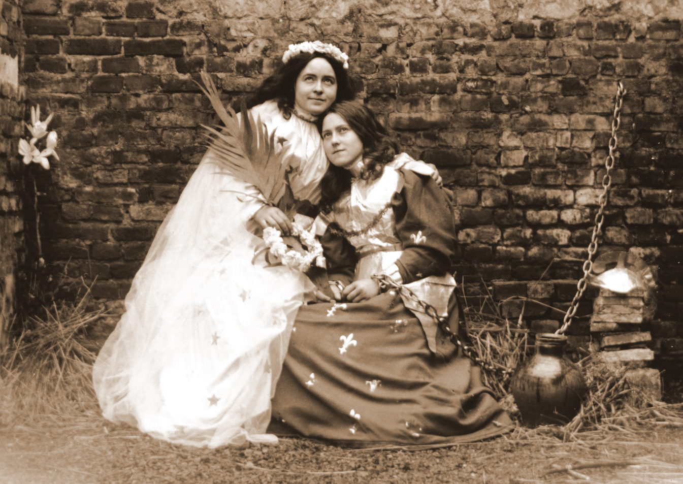 Céline Martin and St. Thérèse of Lisieux pose in costume for a play about Joan of Arc.