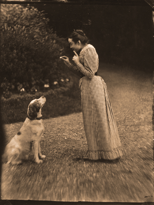 Céline Martin sits beside the Martin family dog, Tom.