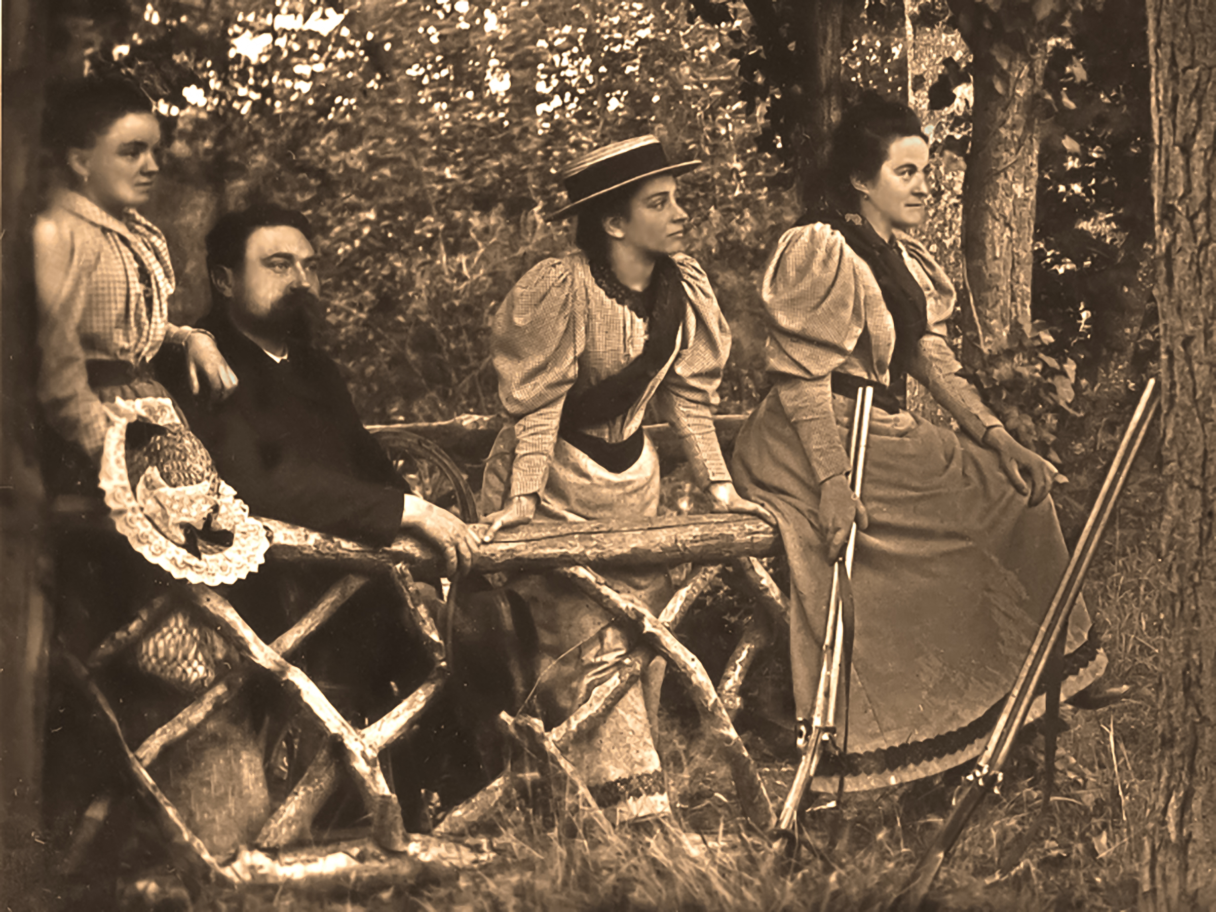 Francis and Jeanne, Marie Guérin, and Céline Martin rest together outdoors.
